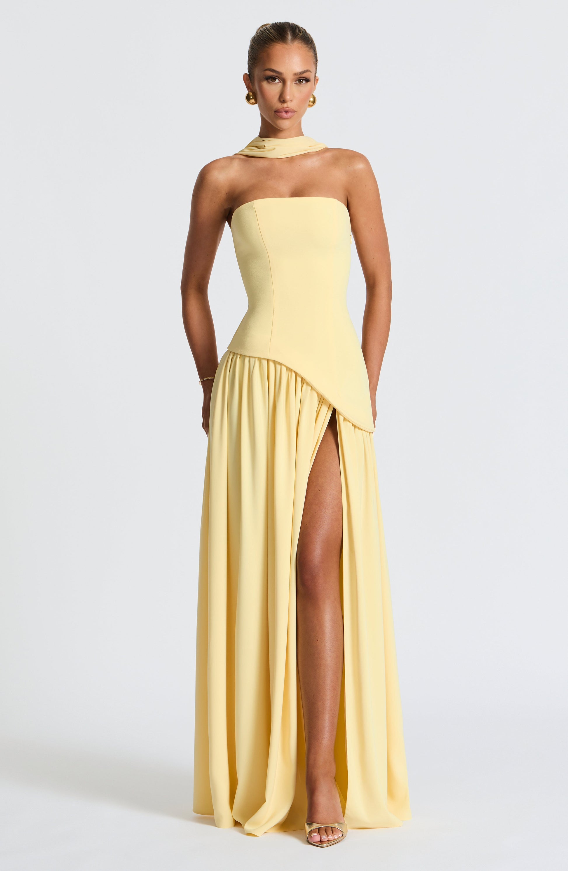 Black strapless evening gown sculpted bodice high slit flowing draped skirt formal elegant silhouette