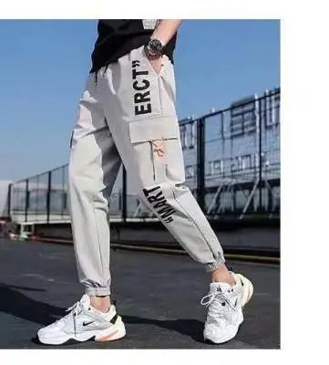 Men's wide-leg cargo workwear pants streetwear style with relaxed fit and bold urban silhouette