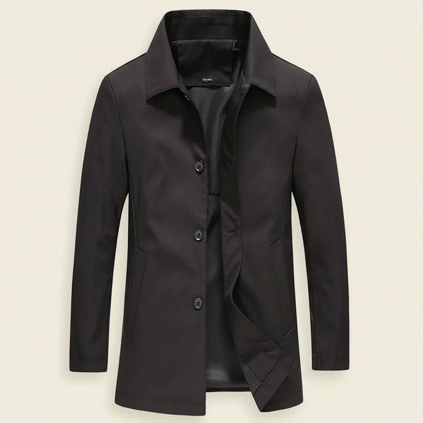 Men's minimalist mid-length overcoat in neutral tone with button-down front closure