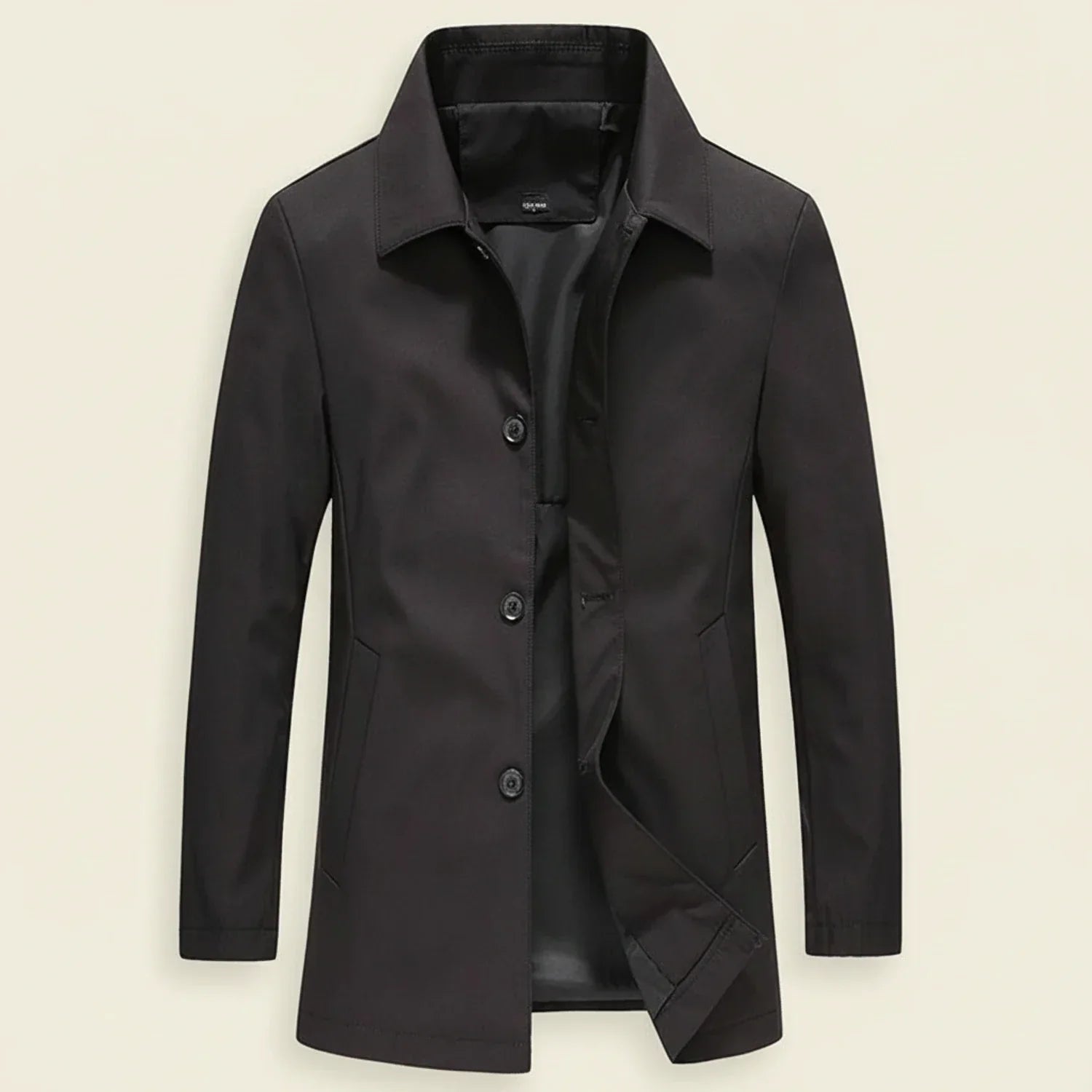 Men's minimalist mid-length overcoat in neutral tone with button-down front closure