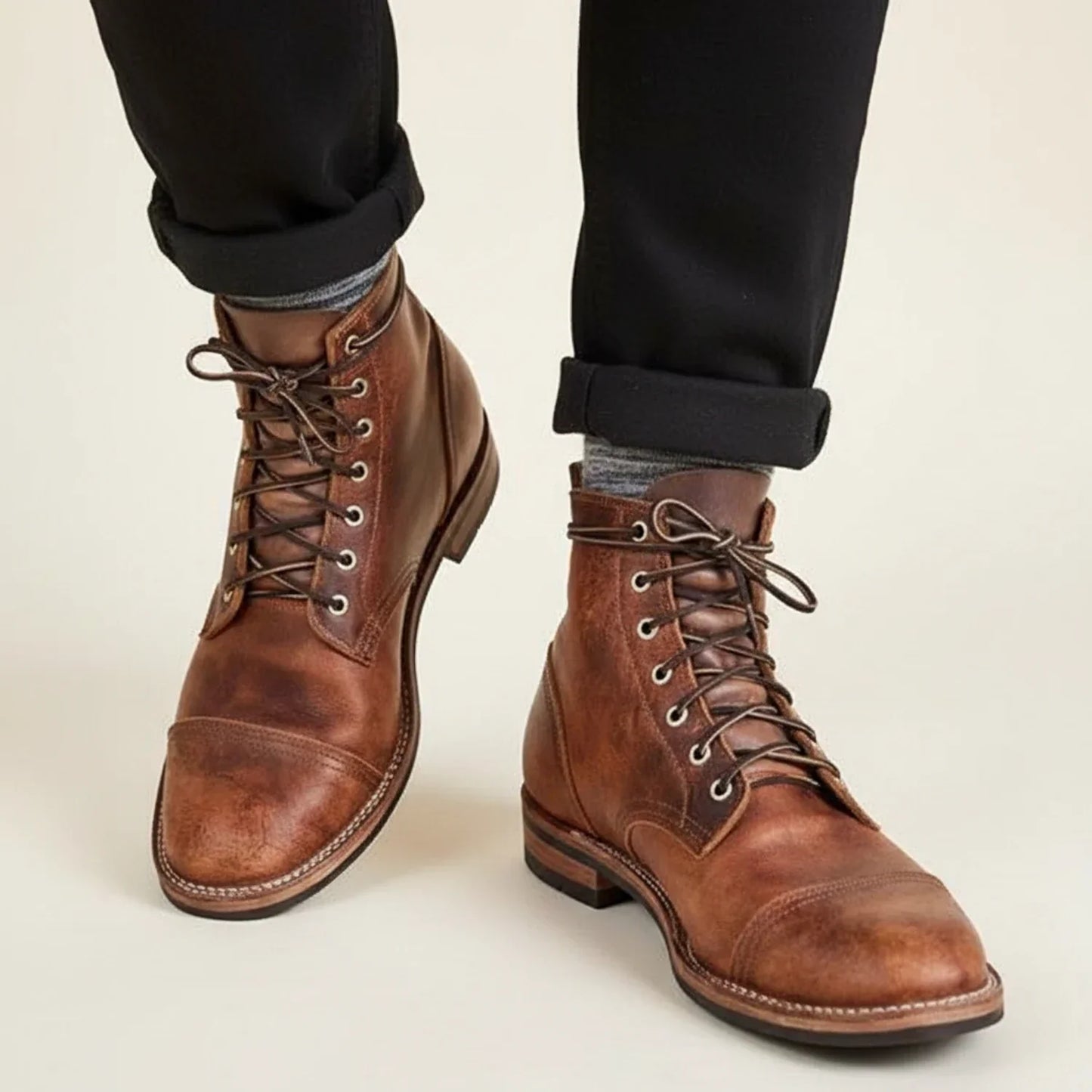 Men's full-grain leather lace-up winter boots with cap toe and panelled detailing rugged style