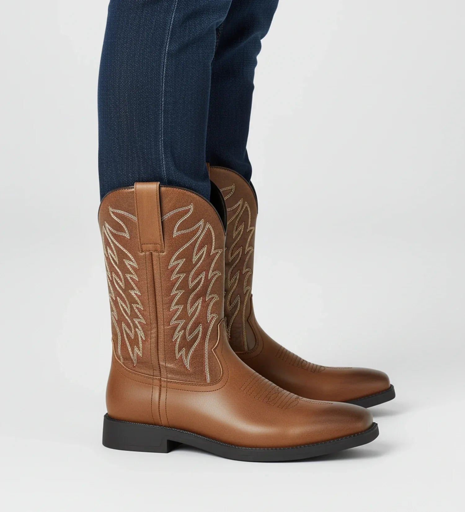 Men's brown mid-calf Western cowboy boots with intricate embroidered stitching, pull-on leather design