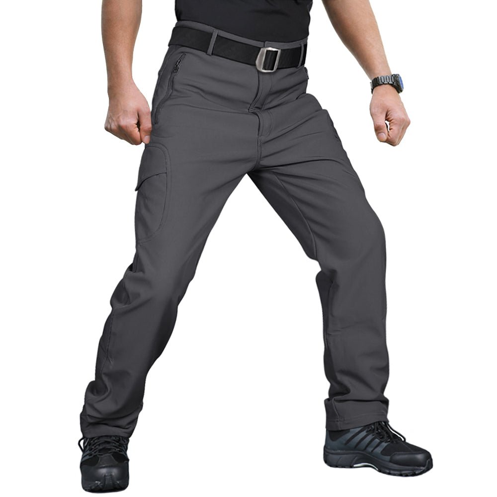 Men's water-resistant combat hiking pants in stretch fabric with reinforced stress points for adventurers