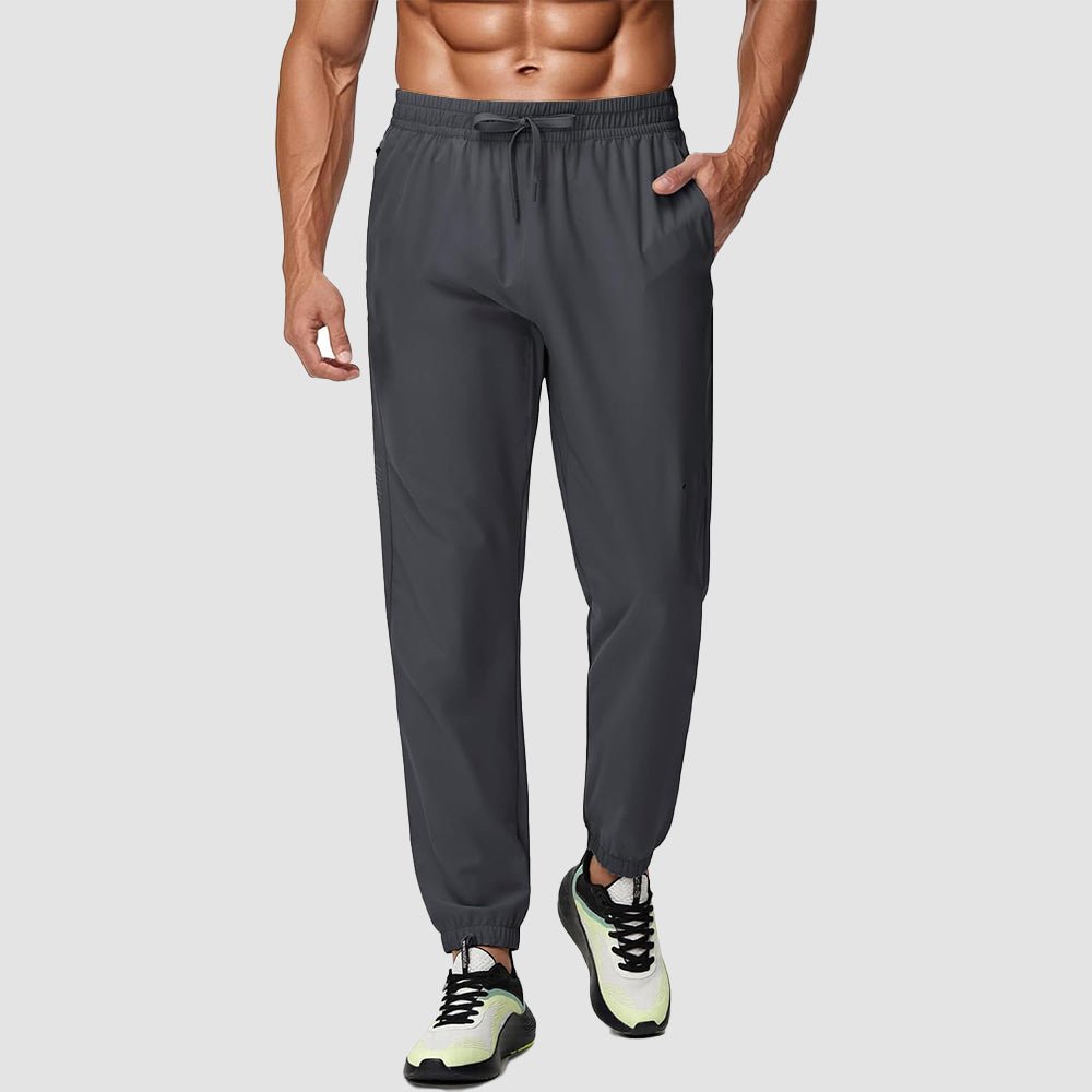 Men's lightweight tapered hiking joggers in gray with UPF 50 protection and reflective adjustable waistband