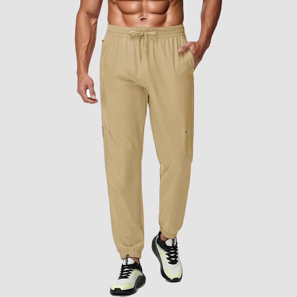 Men's lightweight tapered hiking joggers in gray with UPF 50 reflective details and adjustable waistband