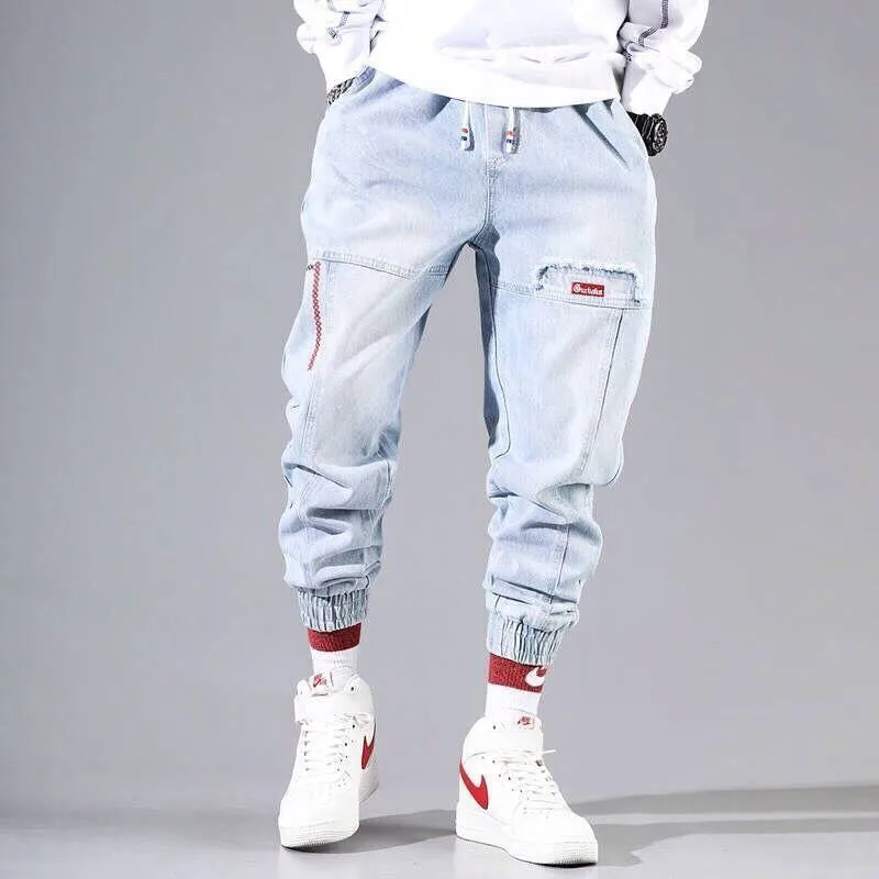 Men's tapered denim jogger pants with elastic waistband and adjustable drawstring for all-day comfort