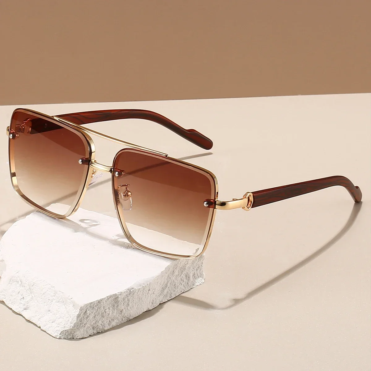 Bold square aviator sunglasses with gradient lenses and sleek gold accents for a timeless look
