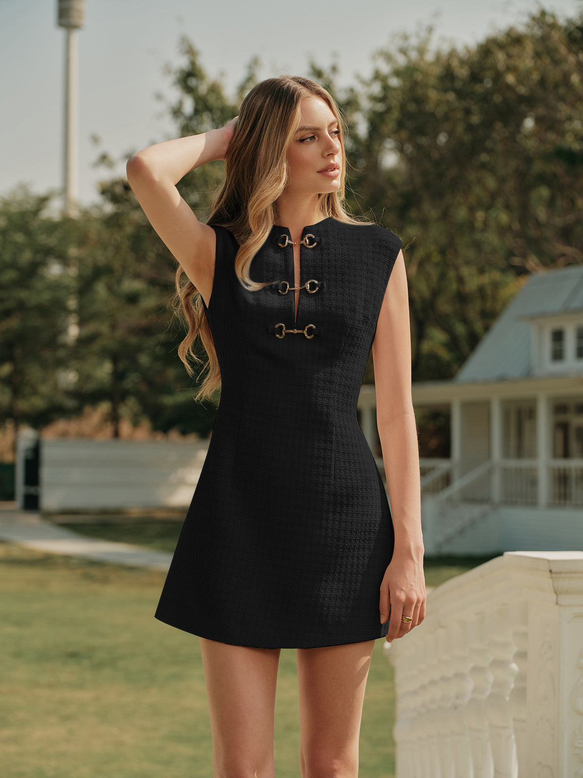 Ivory tweed sleeveless dress with metallic buttons, crew neckline, structured texture for weddings
