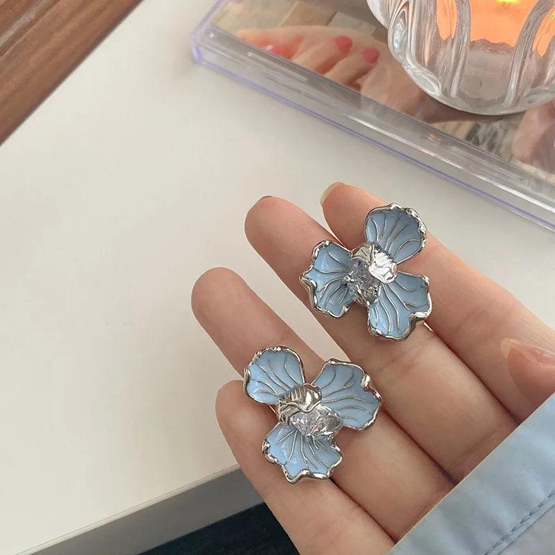 Soft Blue floral enamel stud earrings with vintage-inspired flower motif and delicate metallic shimmer