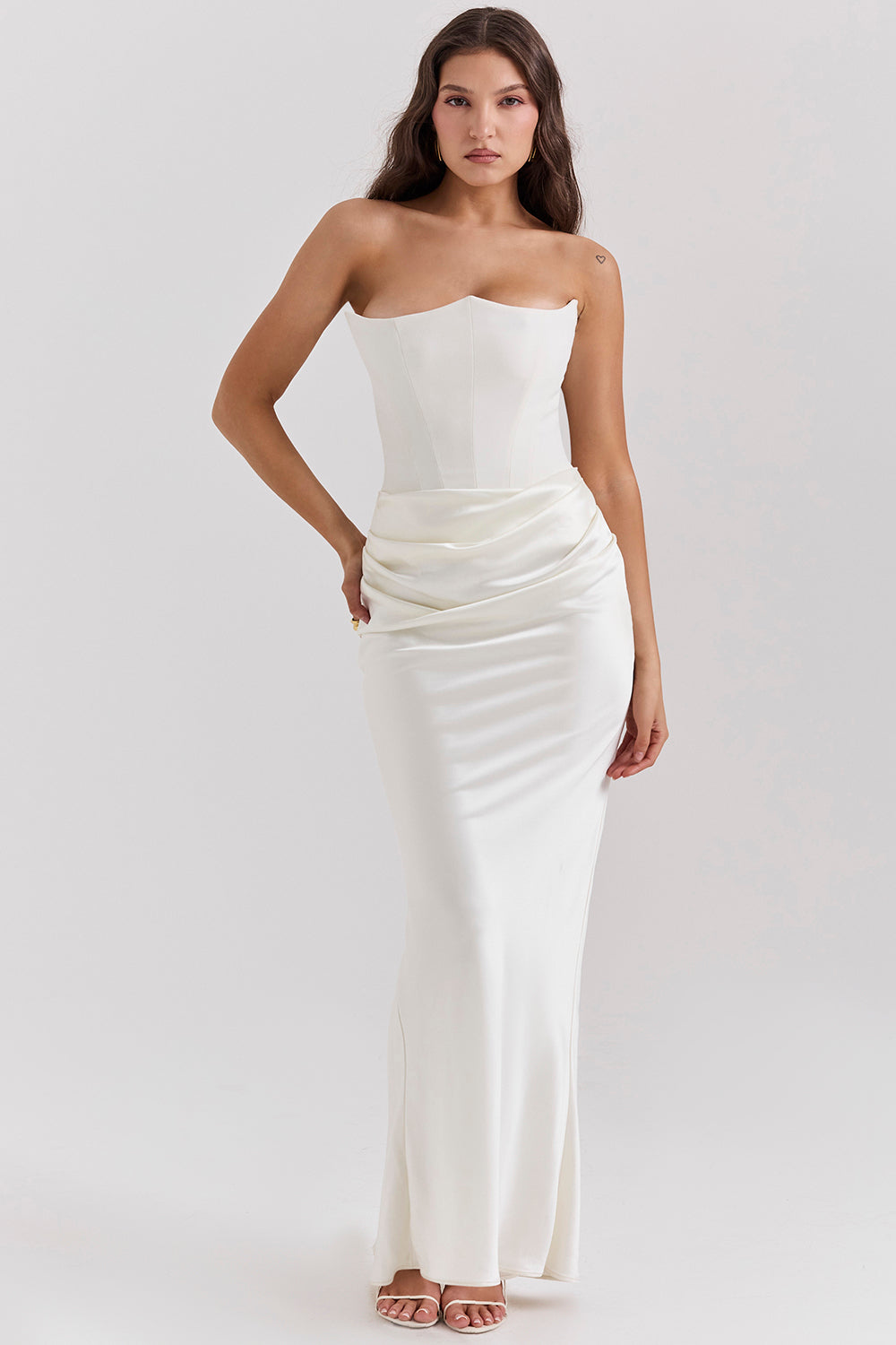 Black strapless floor-length evening gown with structured bodice and elegant draping