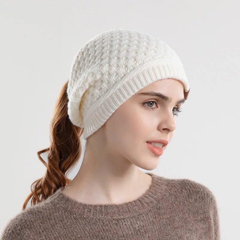 Women's slouchy textured knit wool beanie with ponytail opening, cozy soft casual winter hat
