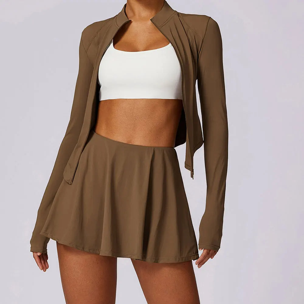 Women's two-piece activewear skirt set with fitted jacket, skater skirt & built-in shorts for gym-to-brunch