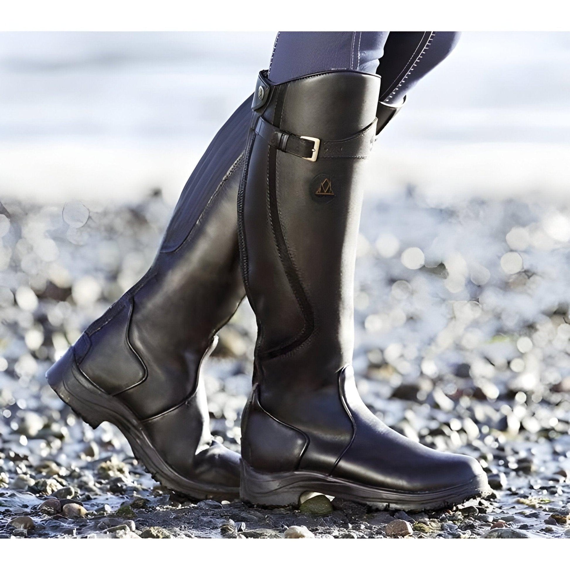 Tall waterproof hiking boots with full leg coverage, secure grip sole, and all-day comfort support