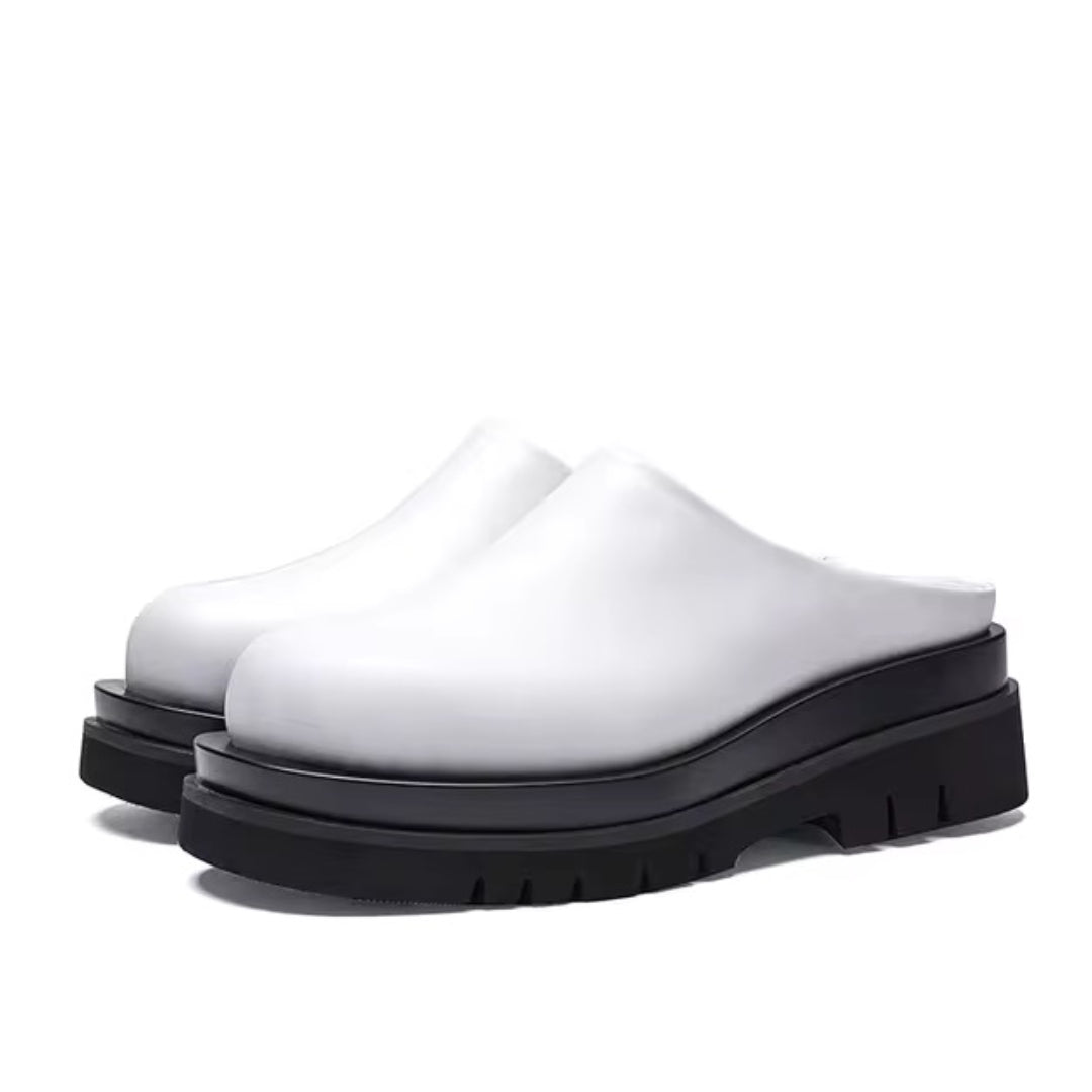 Black leather platform mules bold chunky sole modern silhouette urban casual slip-on shoes