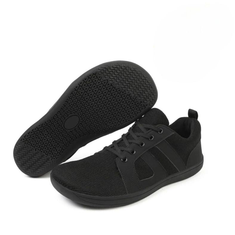 Men's white minimalist leather sneakers with breathable panels and clean classic silhouette
