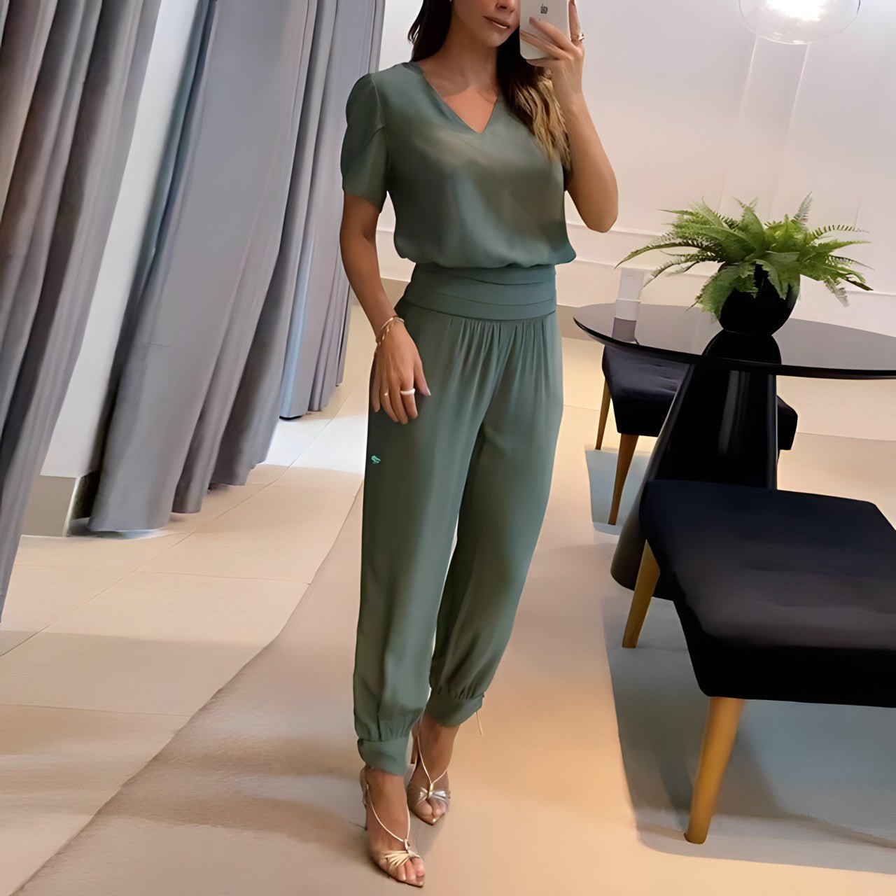 Alaia two-piece blouse and pants set in polished polyester with clean drape for versatile work and casual wear