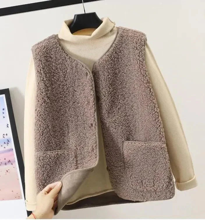 Women's cozy plush vest in soft neutral tones, lightweight sleeveless layering piece with ultra-soft fabric