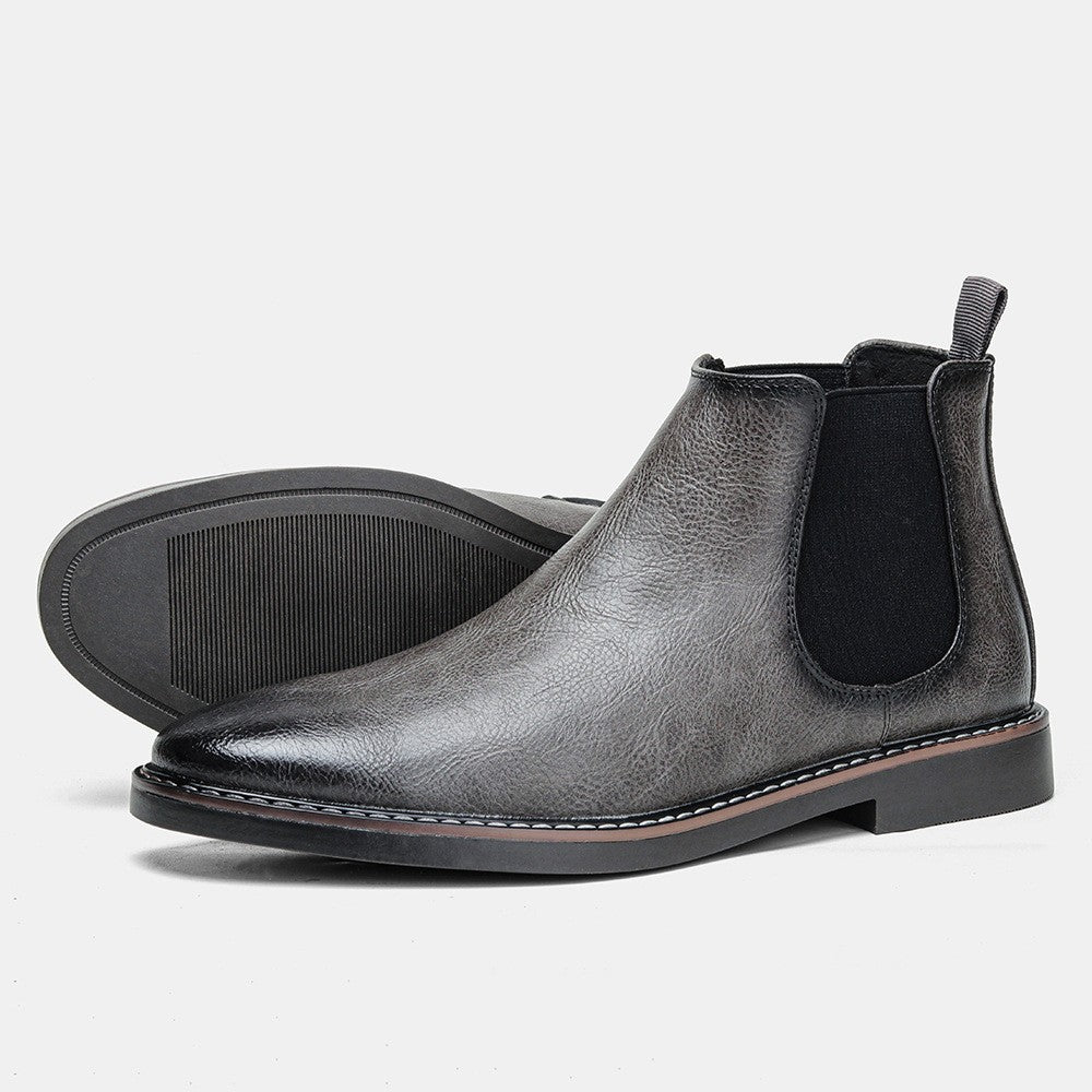 Men's black leather Chelsea boots with elastic side panels and sleek timeless silhouette