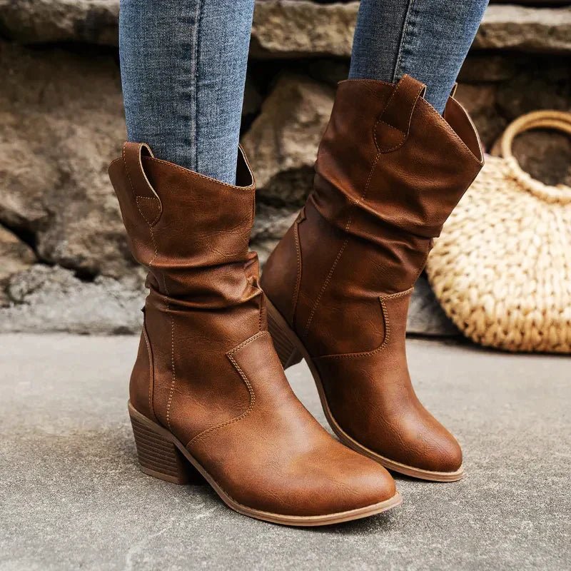 Women's mid-calf Western slouch boots in classic tan leather with pull-on design and relaxed silhouette