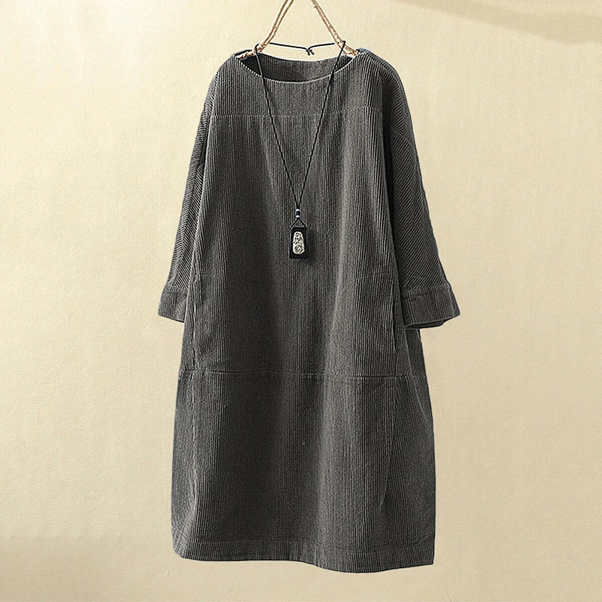Women's burgundy corduroy loose fit knee-length dress with round neck and long sleeves