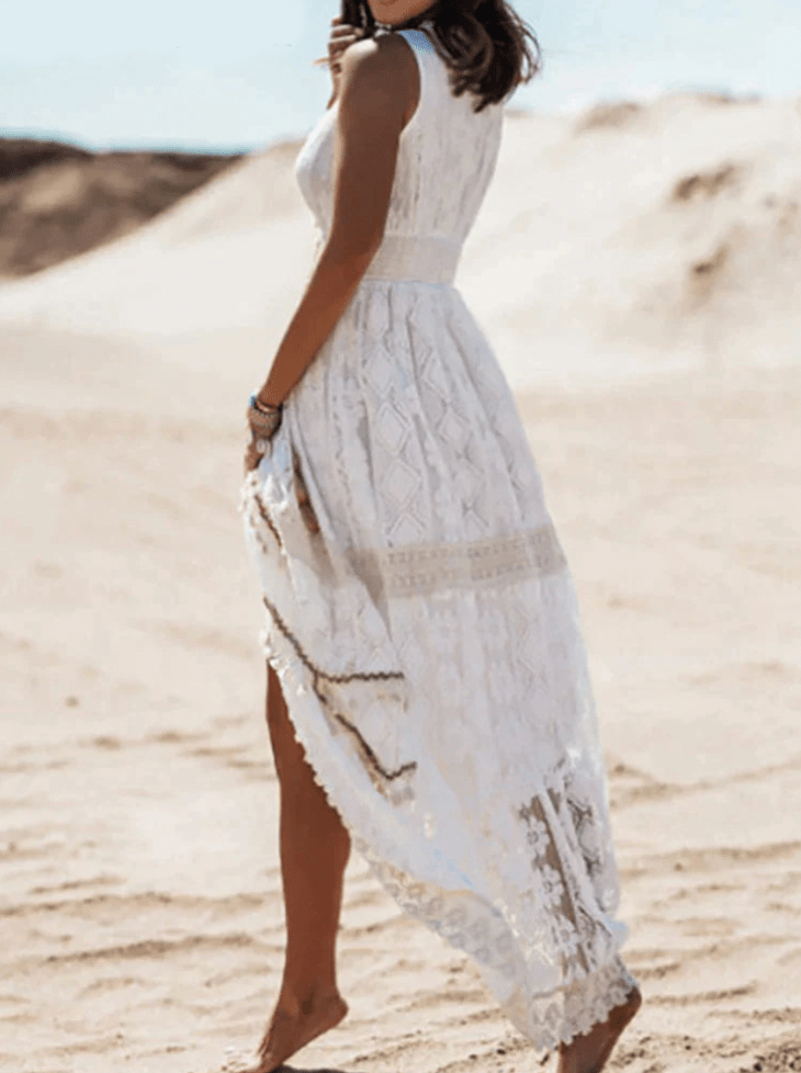 Boho maxi dress with V-neck lace embroidery, flowing high-slit silhouette in relaxed feminine fit