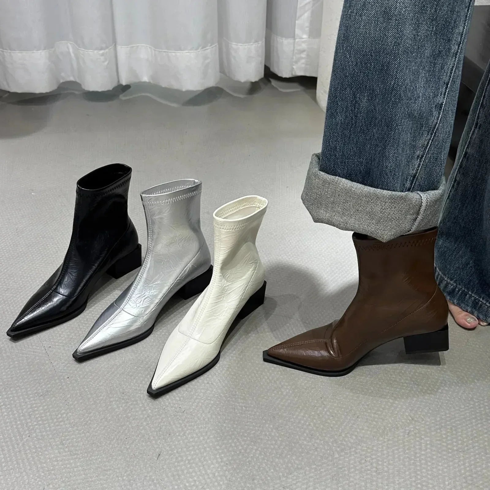 Women's silver metallic pointed-toe ankle boots with block heel, sleek silhouette for day-to-night styling