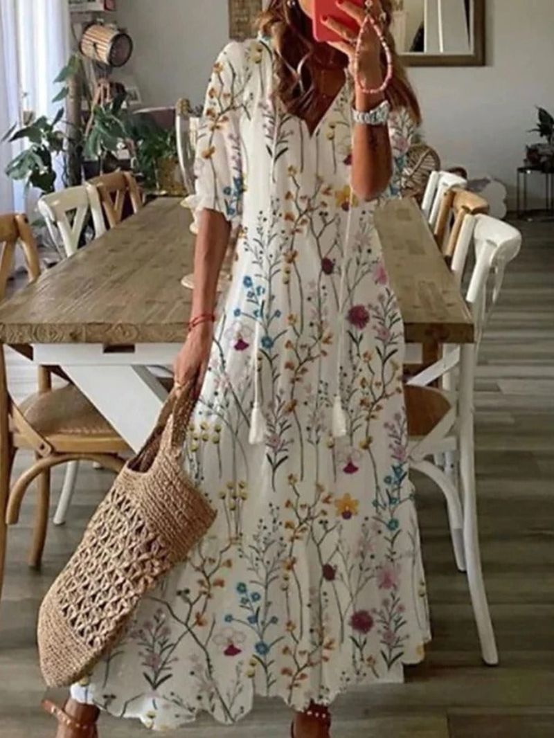 Women's lightweight floral maxi dress, loose V-neck fit in soft airy fabric, perfect for summer