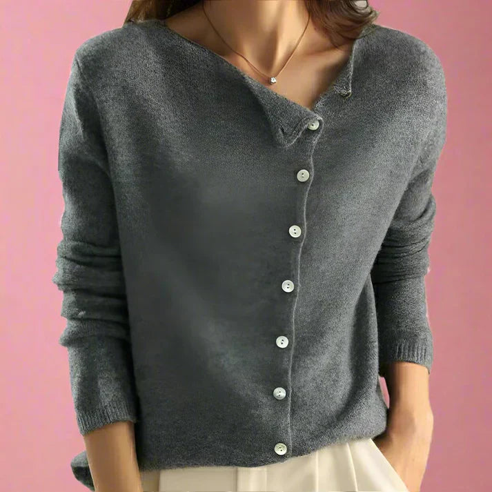 Women's asymmetrical button cardigan in neutral tones, elegant layering piece with modern button detail