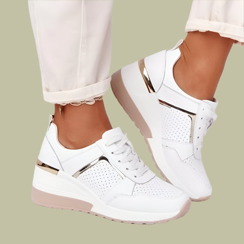 Women's white wedge sneakers with breathable perforated upper and lace closure for all-day comfort