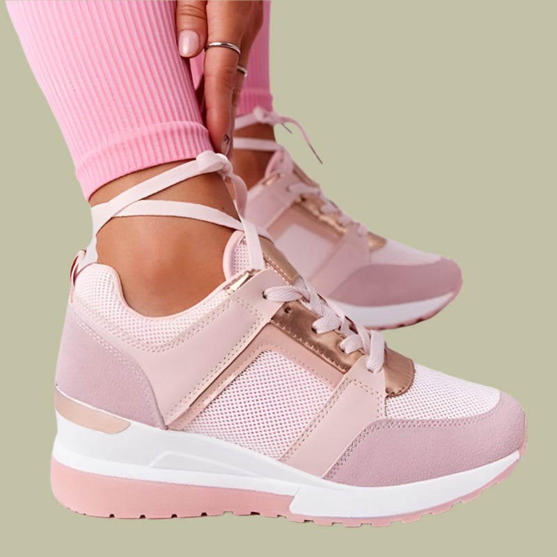 Women's white wedge sneakers with breathable perforations and lace closure for all-day comfort