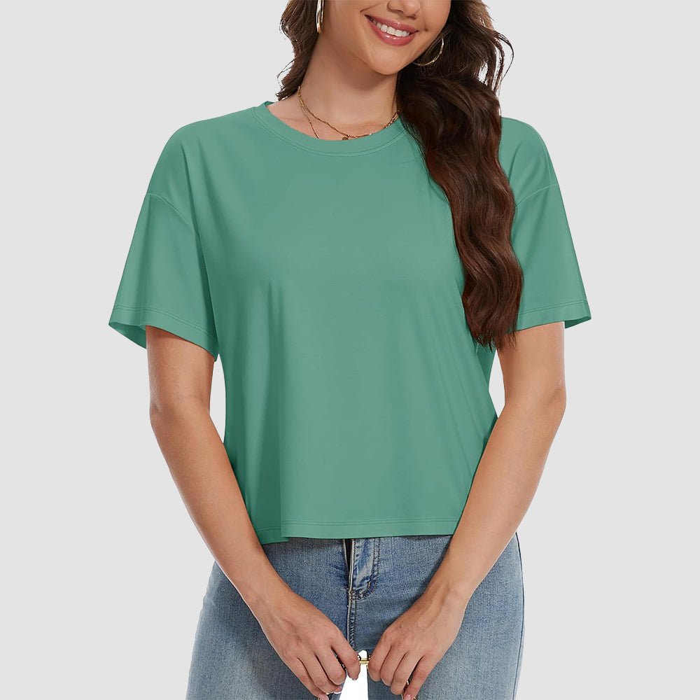 Women's white cotton crop top with UPF 50+ sun protection, relaxed fit, moisture-wicking breathable fabric