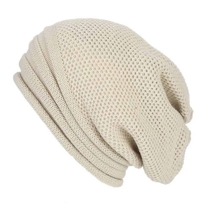 Women's oversized knitted beanie Nina cozy wool winter hat with stretch fit in neutral tones