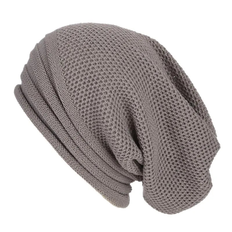 Women's oversized knitted beanie Nina cozy wool winter hat with stretch fit in neutral tone