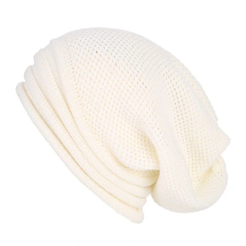 Women's oversized knitted beanie Nina cozy wool winter hat with stretchy loose fit in neutral tone