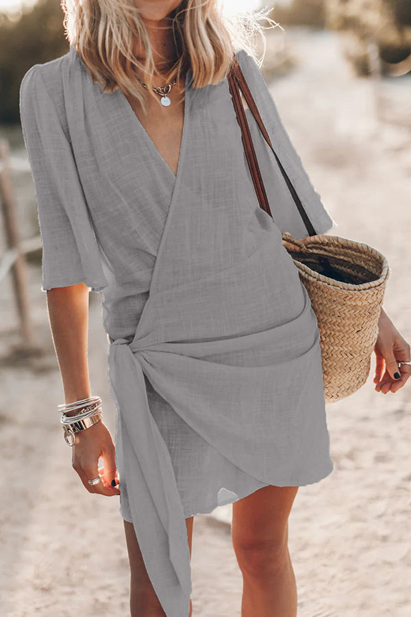 Nova wrap mini dress in soft natural fabric with V-neck and adjustable tie waist for women