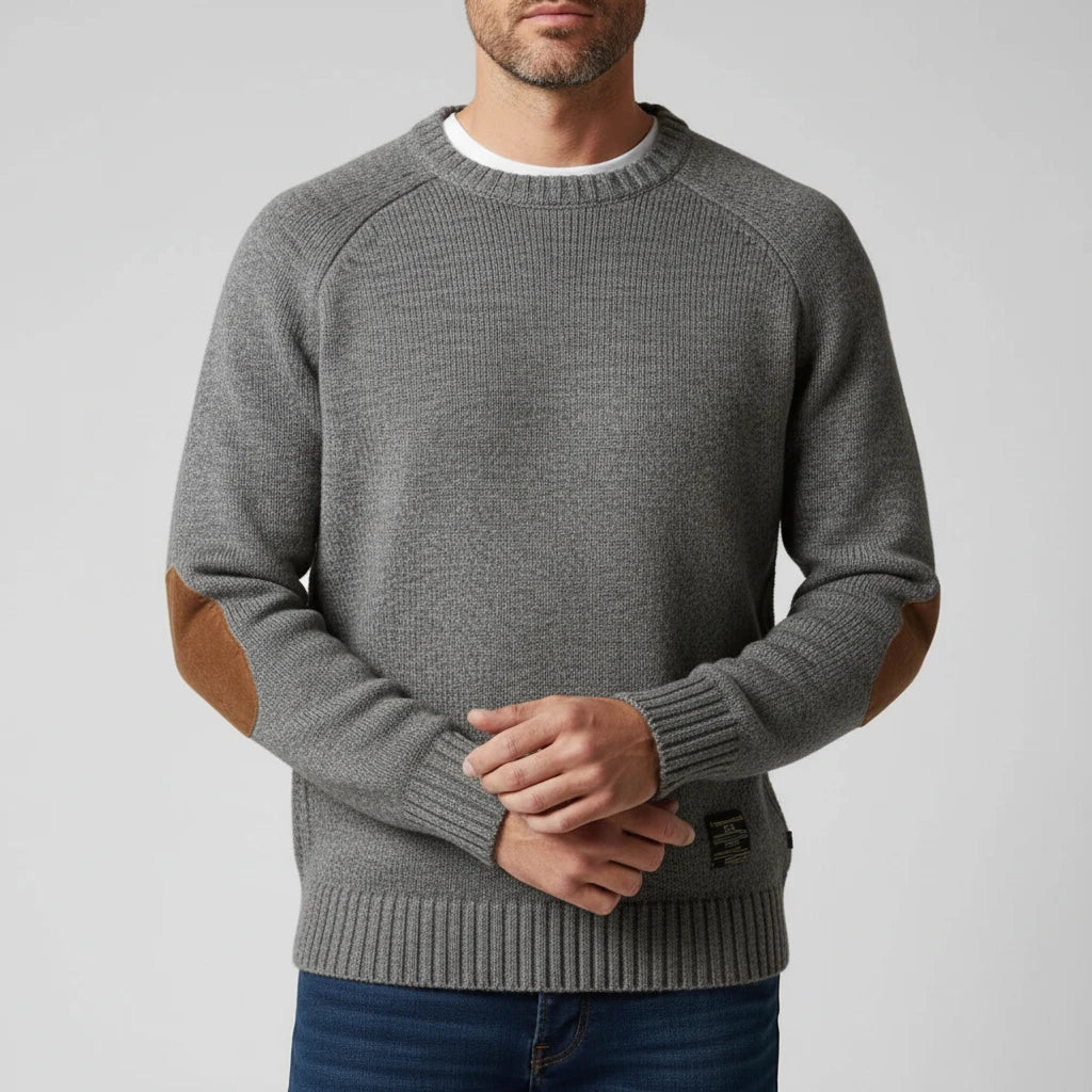 Men's classic red crew-neck knit sweater with raglan sleeves, ribbed hem, and reinforced elbow patches
