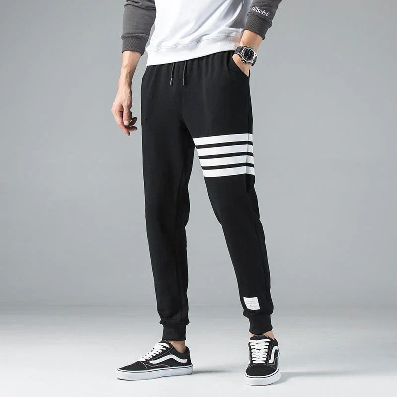 Men's gray striped cotton-blend jogger sweatpants with adjustable drawstring waist and tapered fit