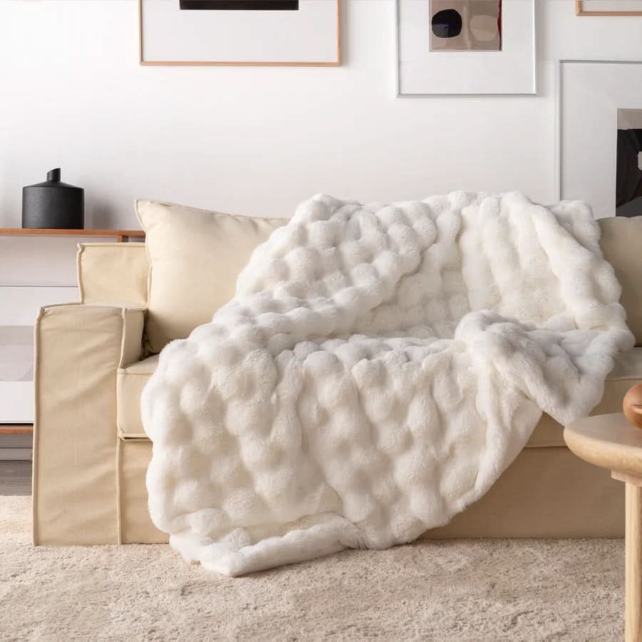 Light blue plush faux fur throw blanket chunky minimalist double-sided design for couch or bed