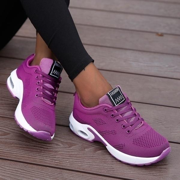 White lightweight air cushion walking sneakers with breathable knit upper and visible sole cushioning unit
