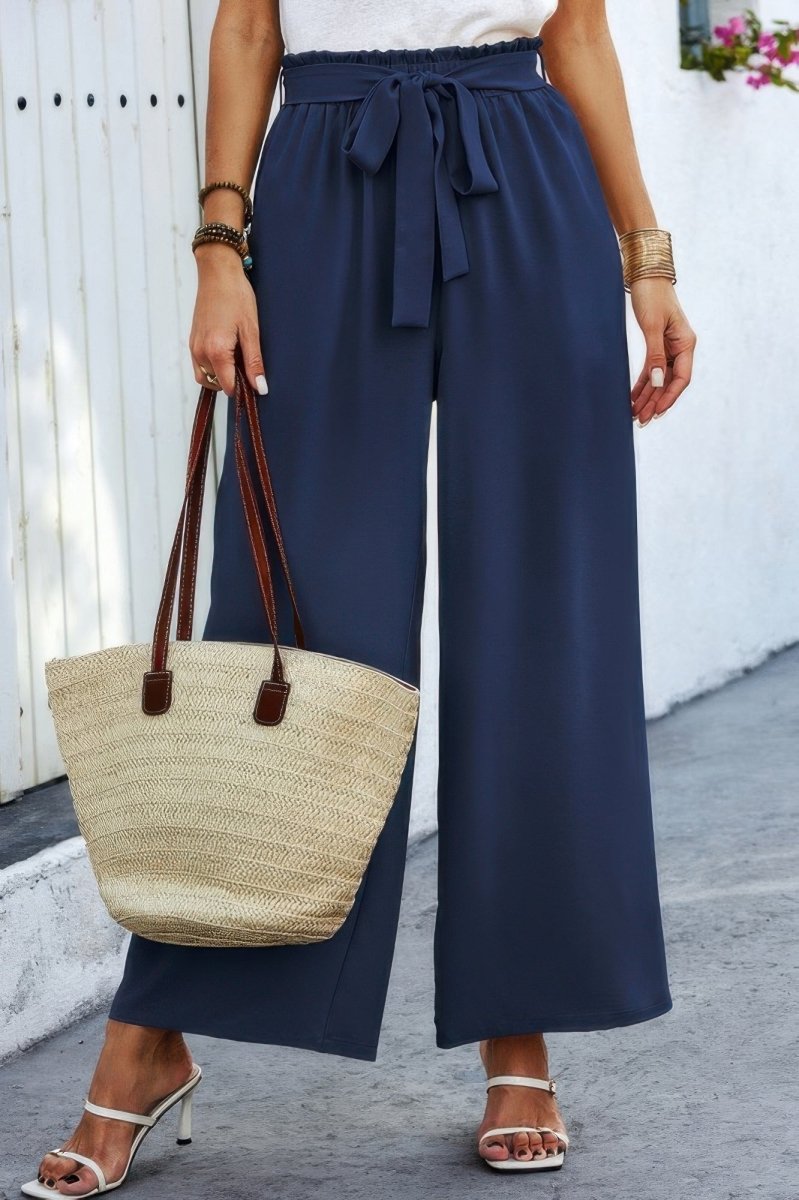 Women's wide leg travel pants with elastic waistband, tie belt, breathable fabric, and side pockets