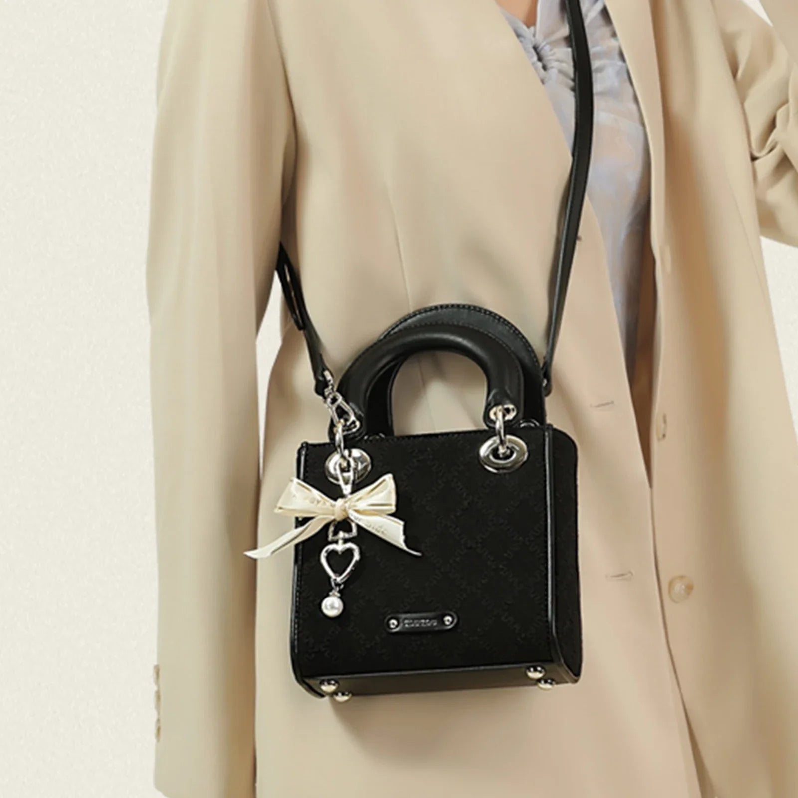 Ivory jacquard structured handbag with delicate bow and pearl charm accent for women