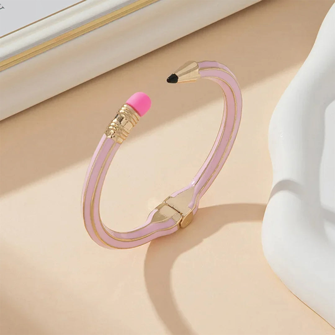 Pink eraser-inspired polished metal cuff bracelet, waterproof statement accessory for creative professionals