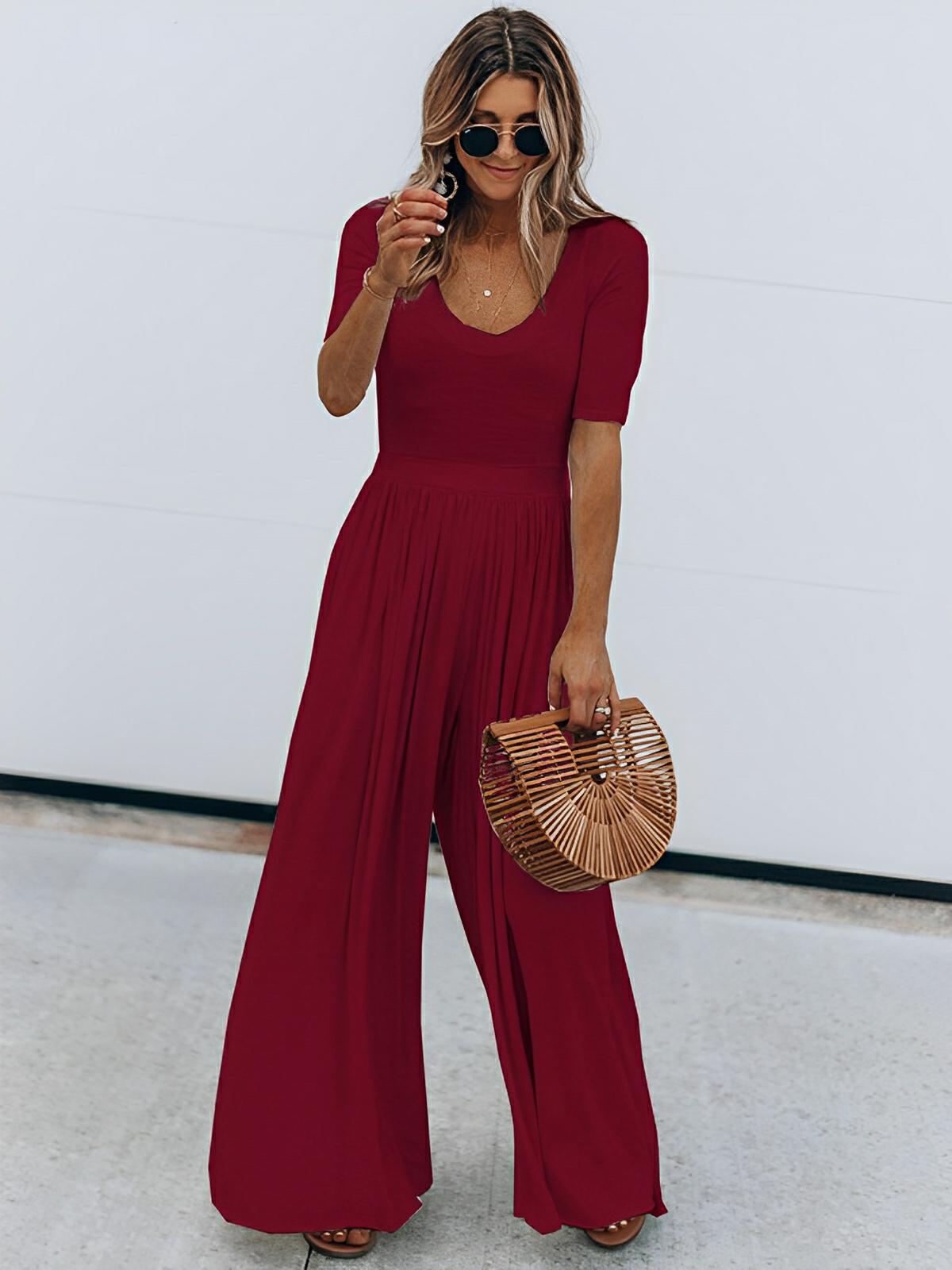 Women's black scoop neck short sleeve polyester jumpsuit, sleek office-to-evening silhouette