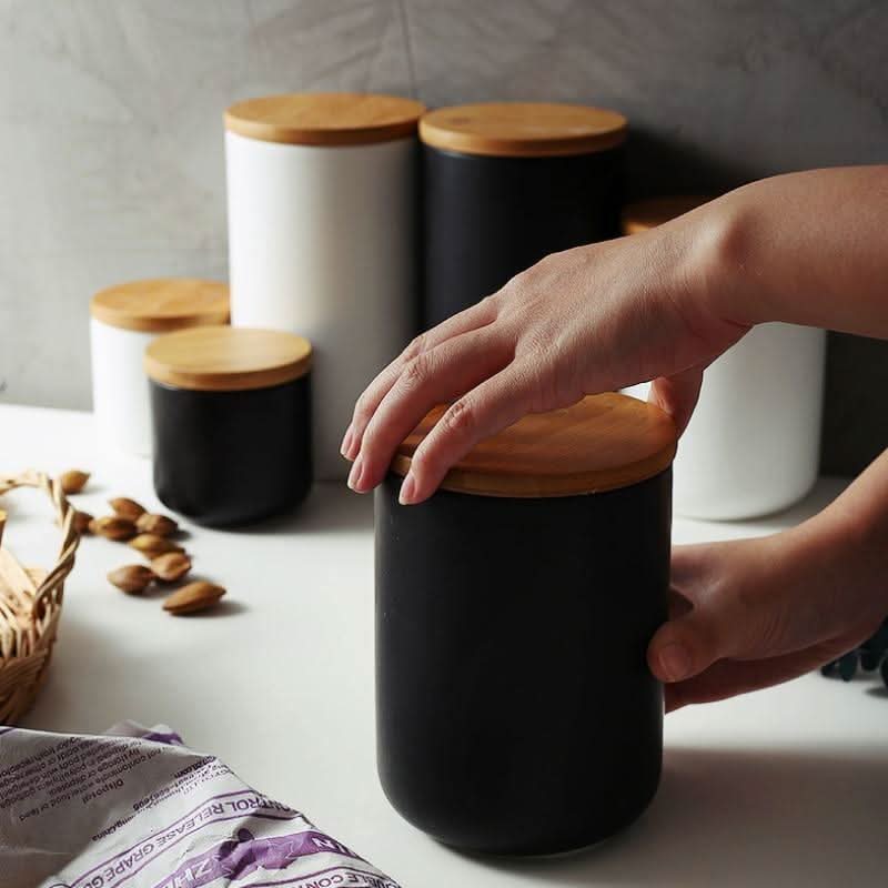 Matte white ceramic kitchen canister with natural bamboo airtight lid, minimalist design for organized storage