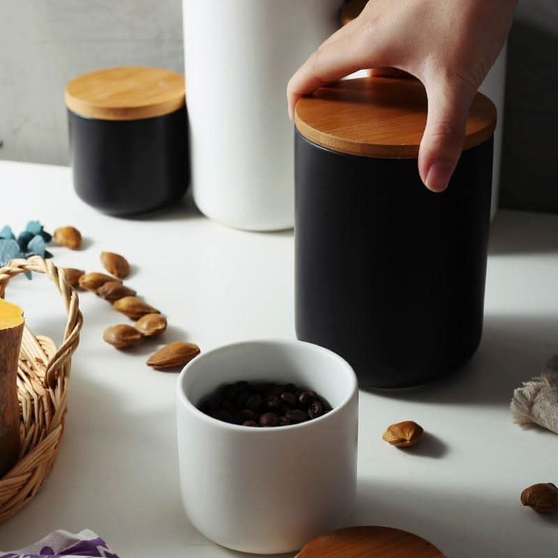 Matte white ceramic kitchen canister with natural bamboo airtight lid, minimalist design for home chefs