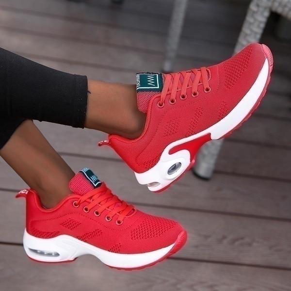White lightweight air cushion walking sneakers with breathable knit upper and visible air unit sole