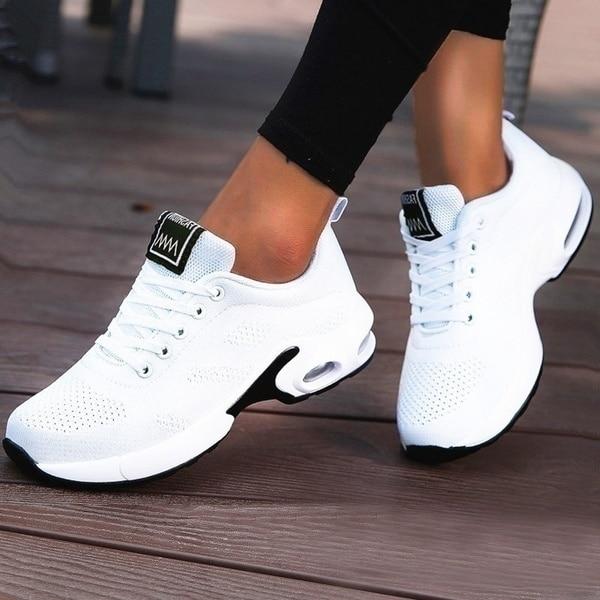 Lightweight breathable knit sneakers with visible air cushion sole for all-day walking comfort