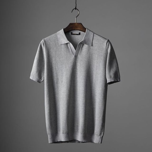 Men's navy blue comfort fit polo shirt with classic collar, versatile for casual and business wear