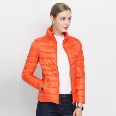 Navy slim fit unisex quilted jacket with high collar, lightweight thermal insulation for outdoor wear