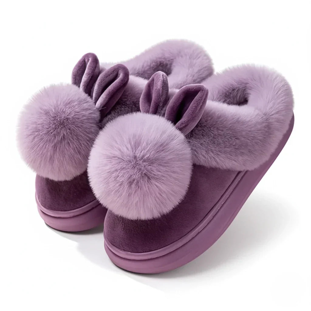 Women's pink plush slip-on slippers with cozy fur trim and playful bunny ears for home warmth